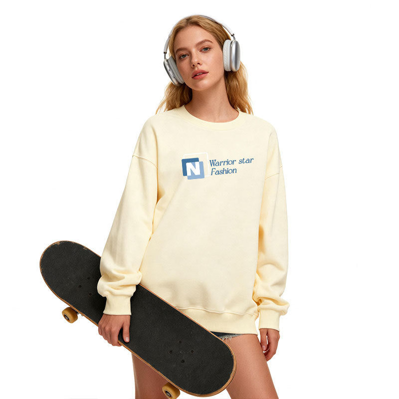 Cream crewneck sweatshirt with N logo graphic, long sleeves, relaxed fit.