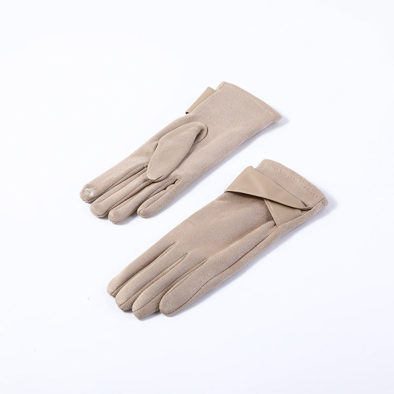 Pair of women’s beige velvet gloves with stitched cuffs and finger seams