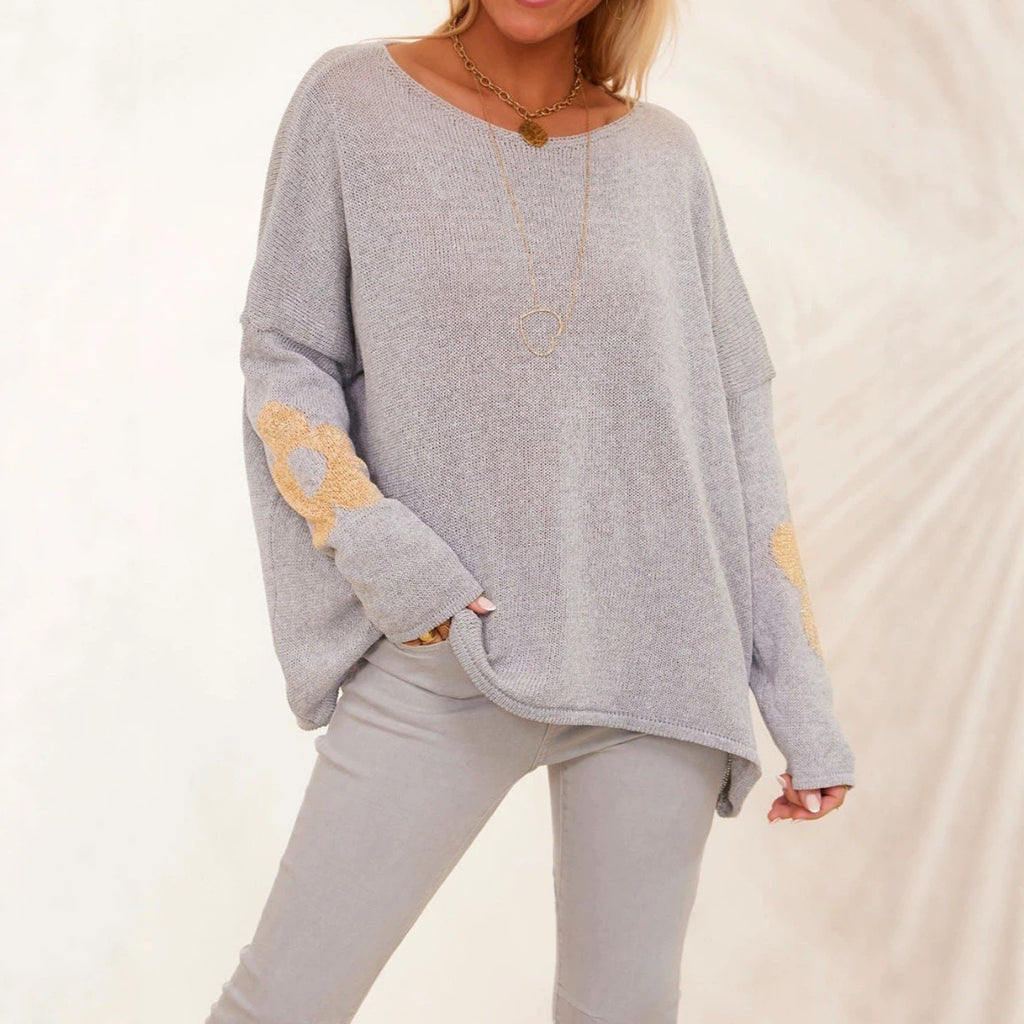 Light gray oversized knit pullover sweater with metallic flower motifs and drop shoulders