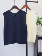 Hollow-out lightweight knit sleeveless vest on hangers, navy and off-white