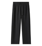 Women’s black wide-leg sweatpants with drawstring waistband and side pockets