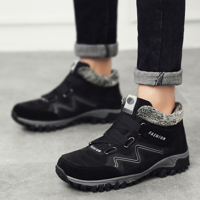 Black snow boots with faux fur lining, hook-and-loop straps, textured lug sole