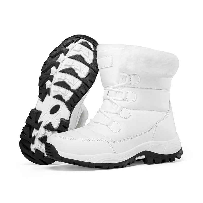 White faux fur lined lace-up snow boots with rugged tread sole, side view.