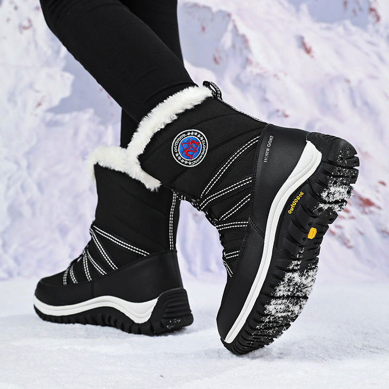 Women’s black mid-calf lace-up snow boots, faux fur cuff and textured lug outsole
