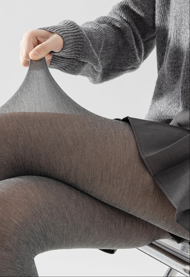 Dark gray heathered tights stretched to show the semi-sheer knit