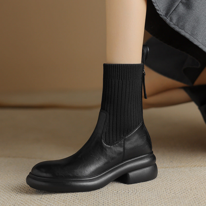 Women's black leather sock boots with ribbed knit shaft and chunky platform ankle sole