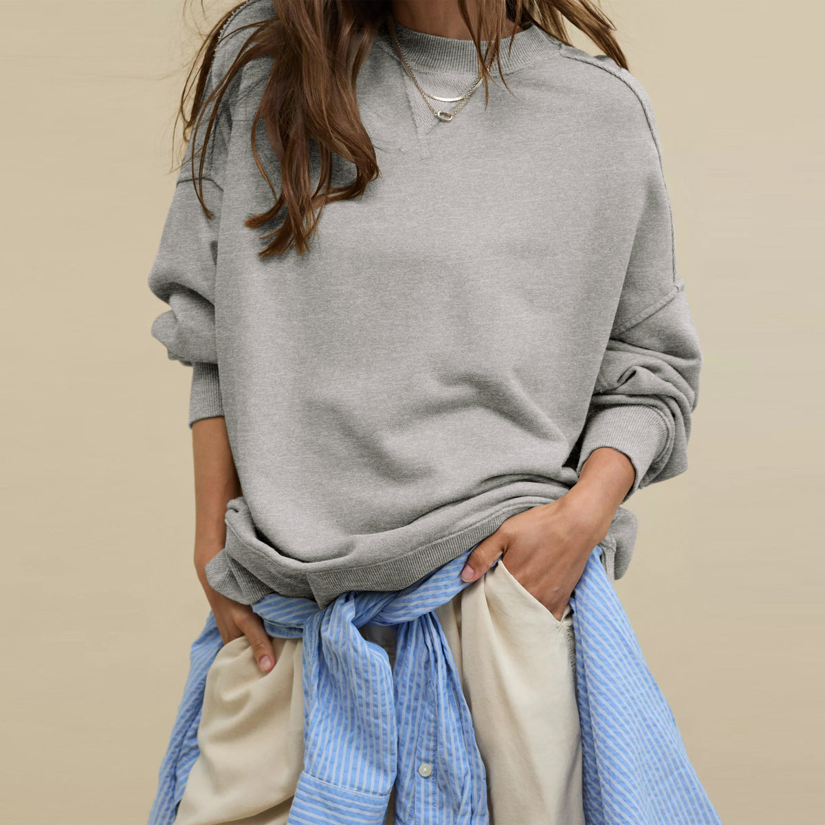 Oversized crewneck sweatshirt in dark gray with exposed seams and side-slit hem