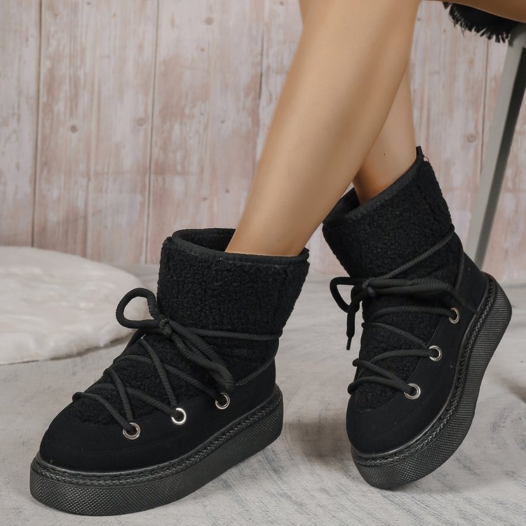 Black sherpa lace-up snow boots with wrap laces and cushioned ankle cuff