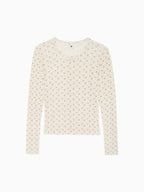 Cream knit cardigan with tiny floral speckle, button front and crew neck