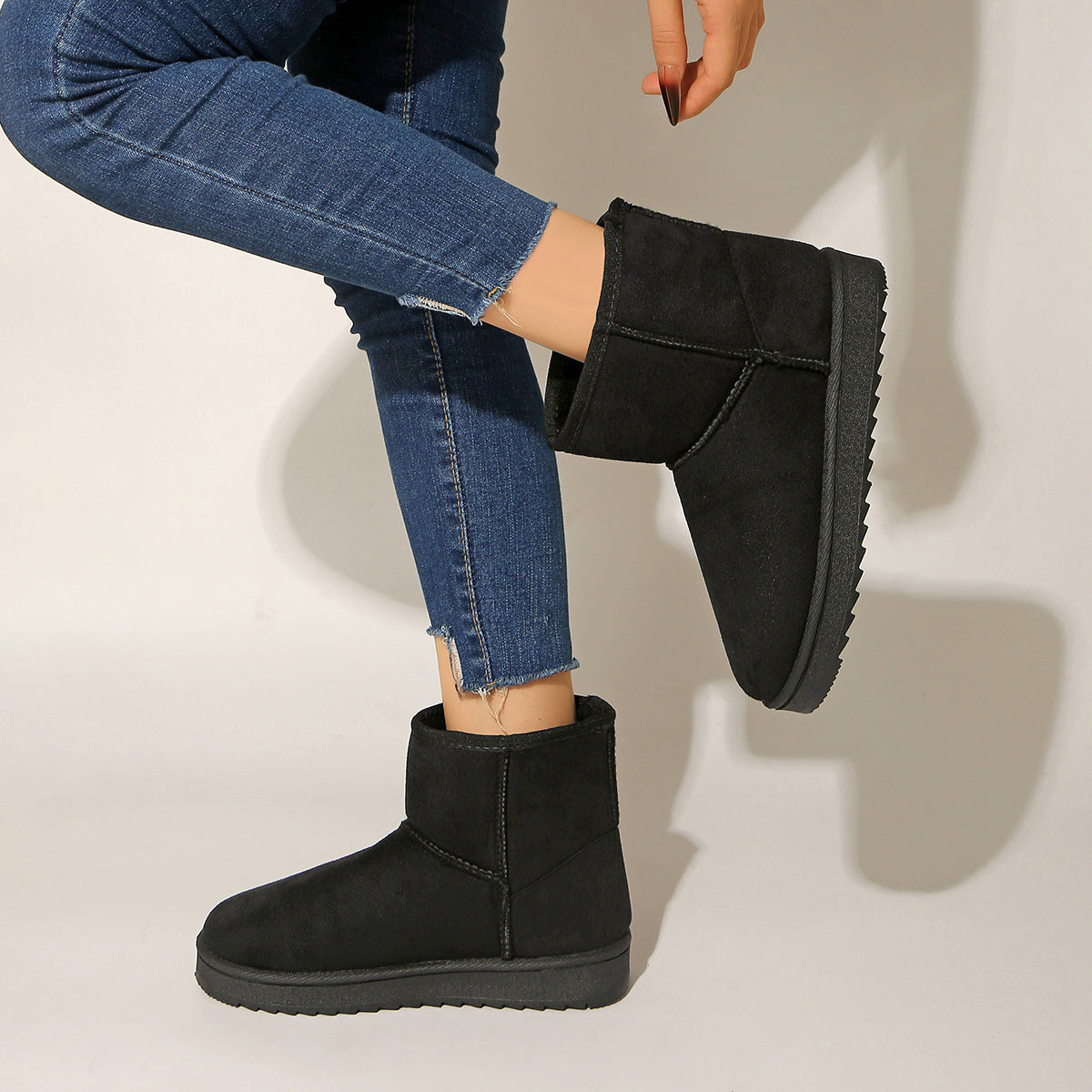 Black ankle boots with round toe, suede-look upper and flat rubber sole