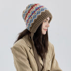 Fair Isle knit earflap bonnet with long ties, beige base with blue and red pattern