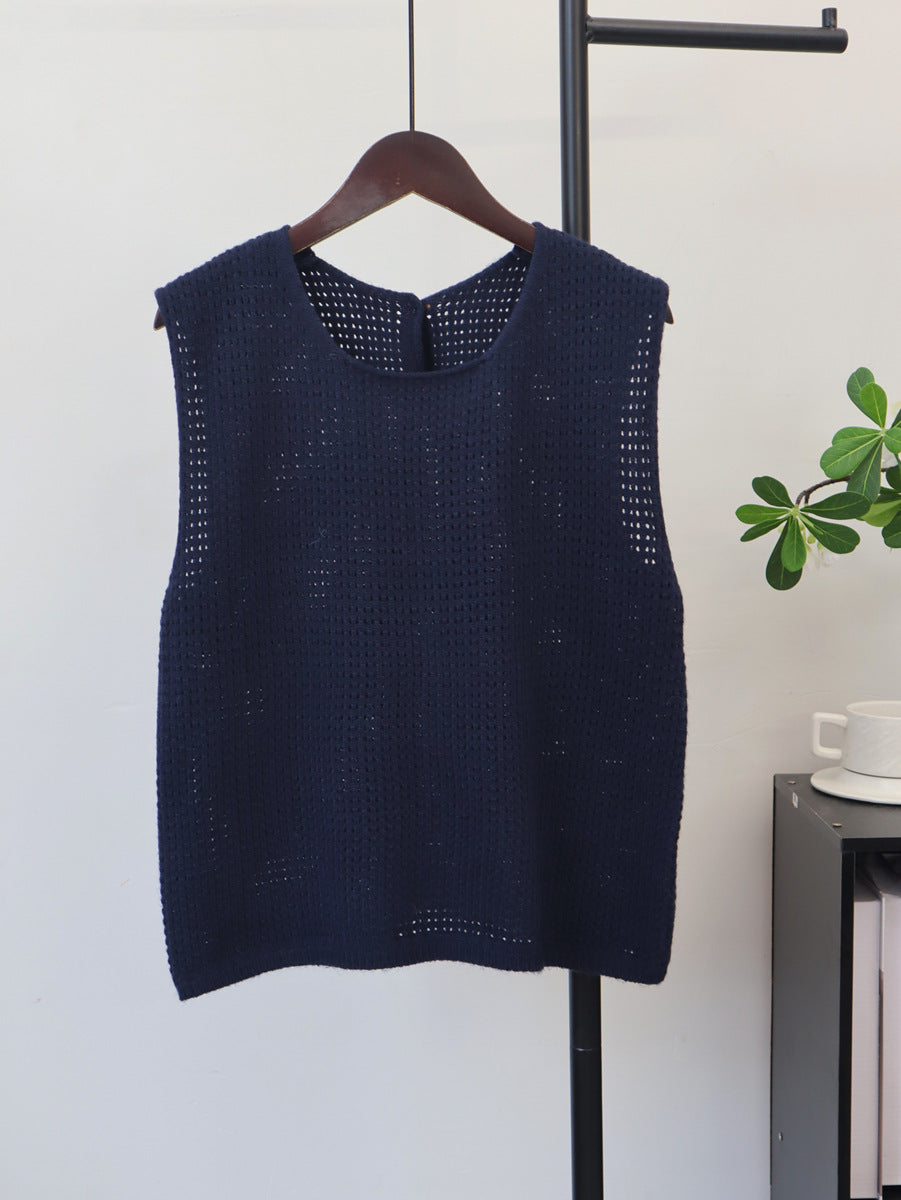 Women’s navy hollow-out lightweight knit sleeveless vest on a hanger