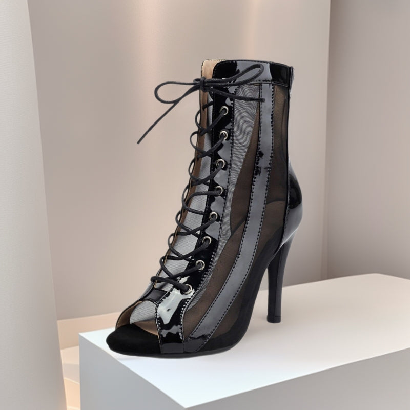 Black peep-toe lace-up ankle booties with sheer side panels and stiletto heel.