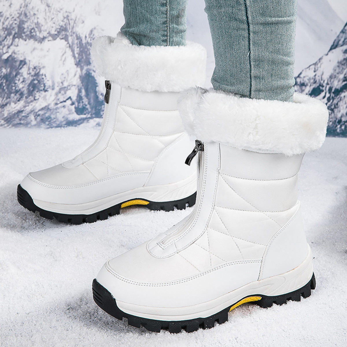 White mid-calf zip-up snow boots with quilted panels, faux fur cuff, lug sole.