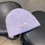 Light purple ribbed knit beanie with wide cuff and woven "pipiswoot" label