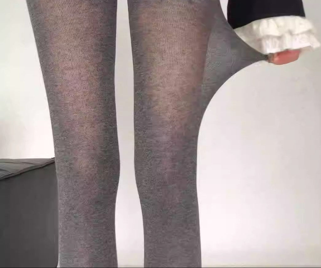 Heathered gray tights close-up showing stretchy, semi-sheer fabric