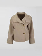 Cropped stand-collar wool jacket in light beige with button front and long sleeves on hanger