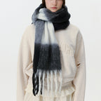 Oversized plaid scarf in dark gray and light gray with long fringed trim