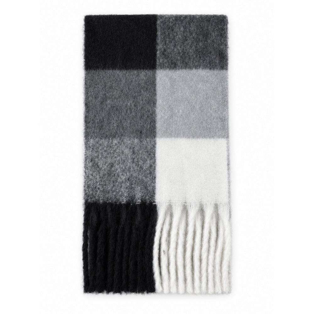 Plaid scarf close-up with black, dark gray, light gray, and white; fringed border