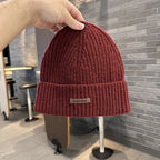 Dark red ribbed knit beanie with wide cuff and woven "pipiswoot" label