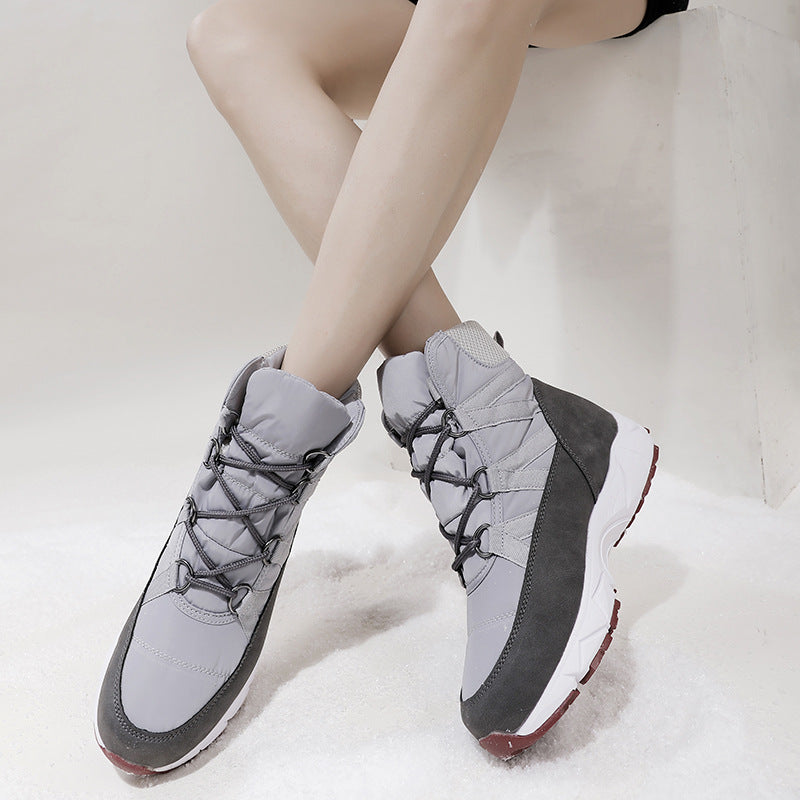 Women's light gray lace-up winter boots with quilted uppers and dark gray side panels