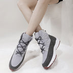 Women's light gray lace-up winter boots with quilted uppers and dark gray side panels