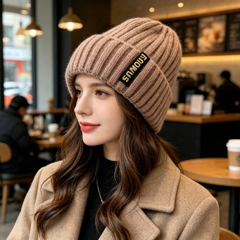 Chunky ribbed beanie in taupe with folded cuff and letter patch