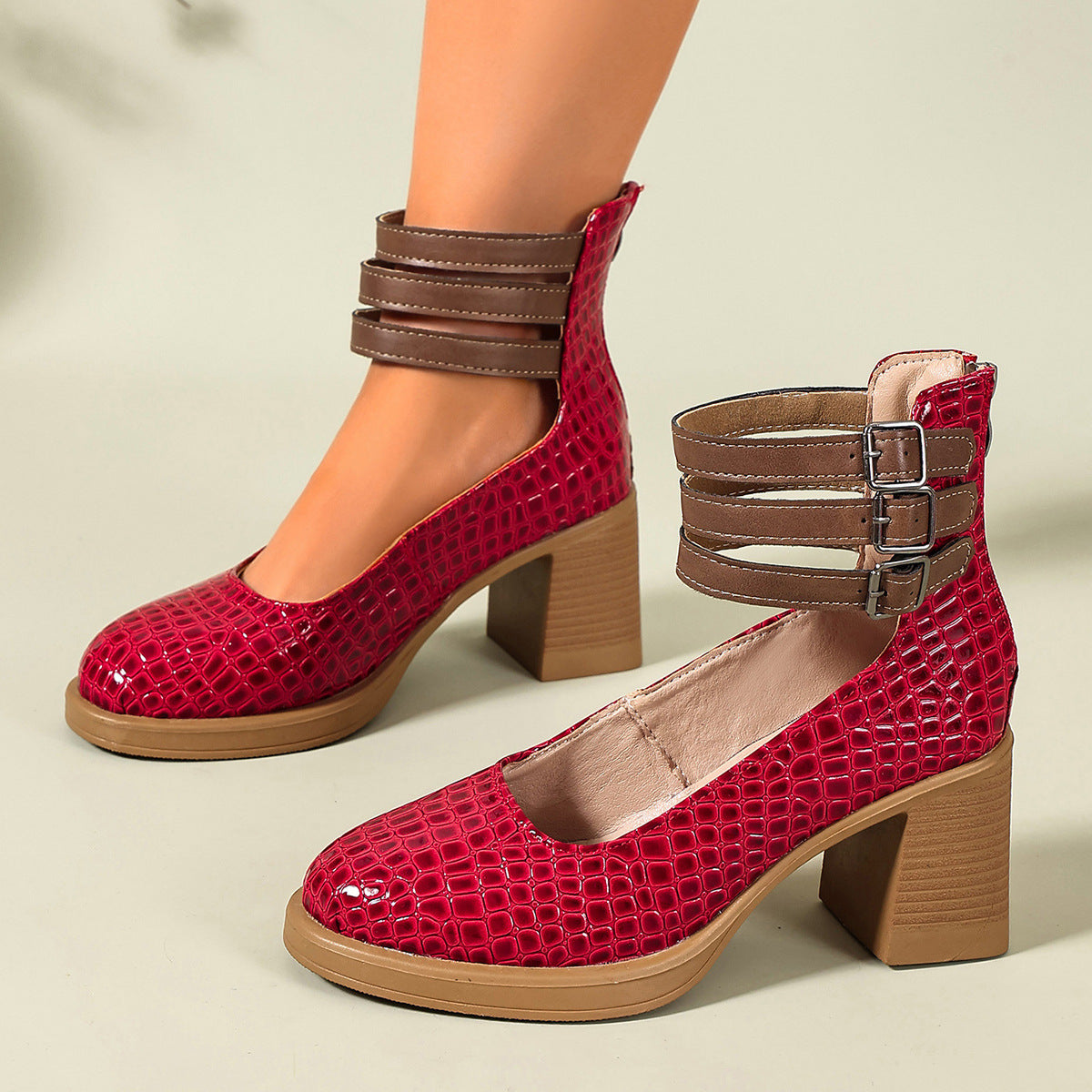 Red croc-embossed platform ankle strap pumps with block heels and triple buckle cuff