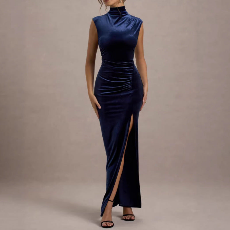 Navy blue velvet maxi dress with mock neck, sleeveless ruched torso, high slit