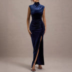 Navy blue velvet maxi dress with mock neck, sleeveless ruched torso, high slit