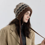 Fair Isle knit earflap bonnet with long tie cords, brown and cream zigzag pattern