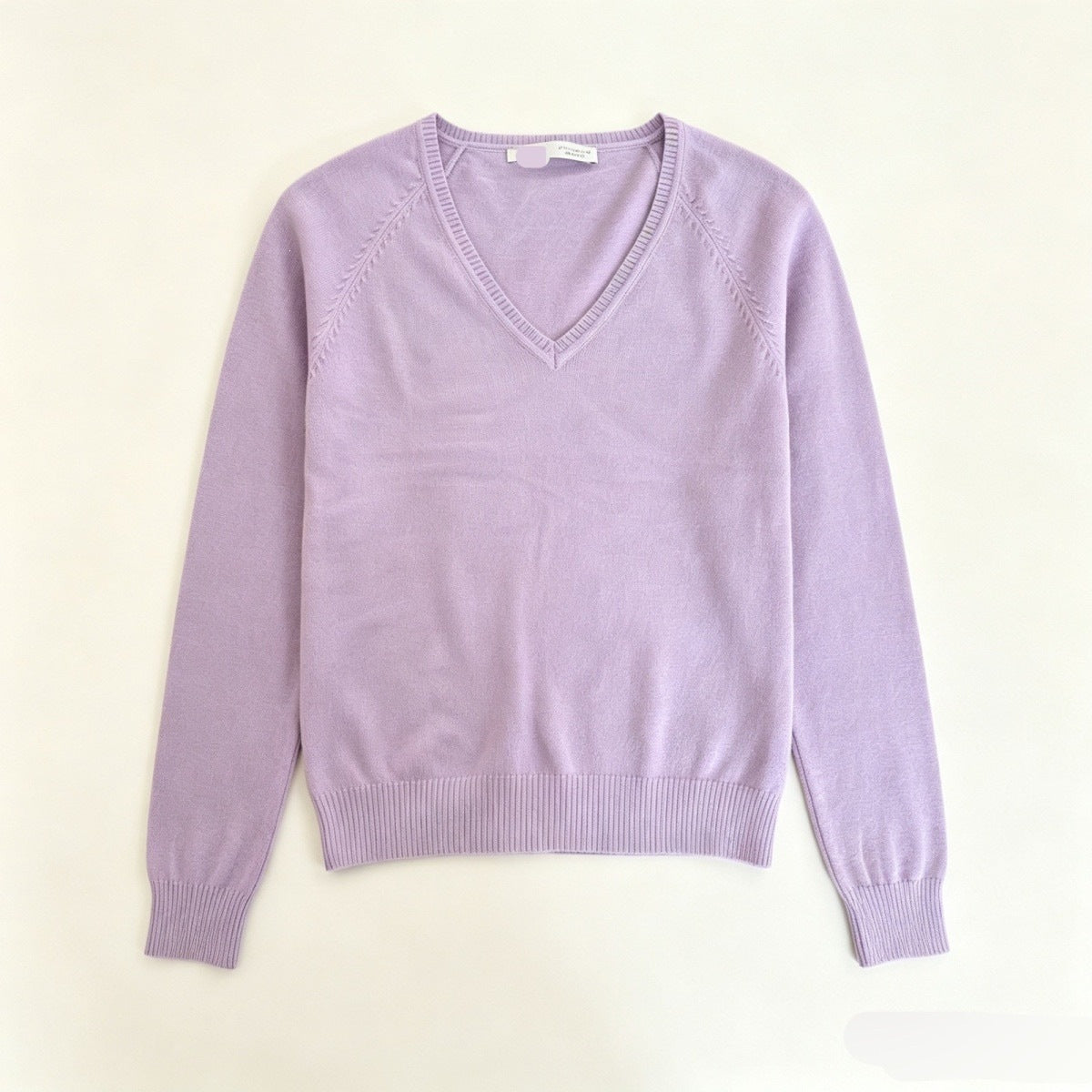 Women’s light purple V-neck fine-knit sweater with long sleeves and ribbed hem