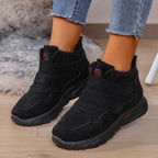 Black high-top sneakers with fleece lining, hook-and-loop strap, and thick sole