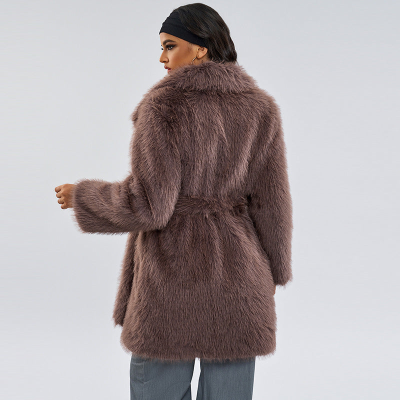 Taupe-brown shaggy faux fur coat with belt at waist, wide shawl collar, back view
