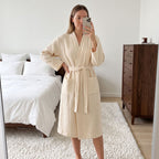 Beige women’s lightweight cotton robe with V-neck, tie belt, and front pockets