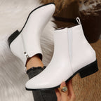 White pointed-toe ankle booties with side zipper and low stacked heel