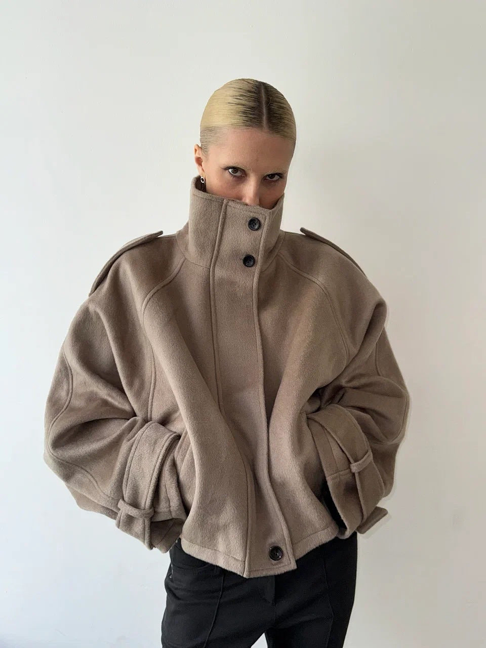 Taupe cropped wool jacket, front view, funnel neck, button front, epaulettes.