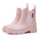 Chelsea rain boots in light pink matte rubber with side elastic panels and lug sole.