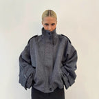 Dark gray cropped wool jacket, funnel neck, button front, epaulettes, cuff tabs.