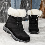 Women’s black lace-up snow boots with faux-fur cuffs and rugged traction sole
