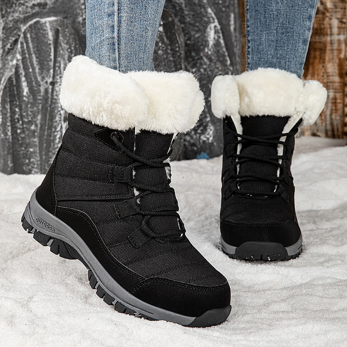 Women’s black lace-up snow boots with faux-fur cuffs and rugged traction sole