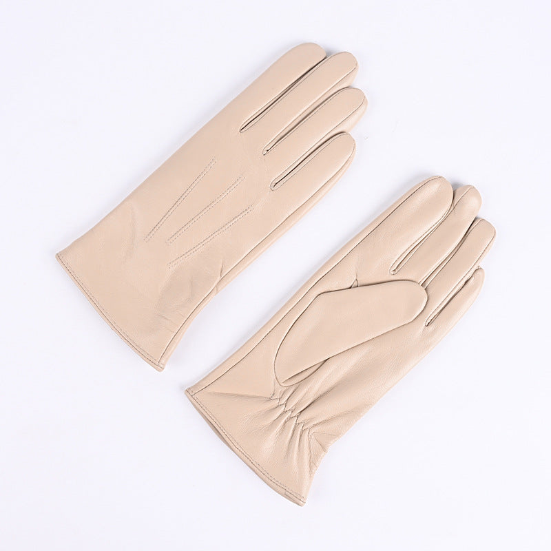 Beige leather gloves with three-strap cuffs, fleece-lined winter style.