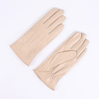 Beige leather gloves with three-strap cuffs, fleece-lined winter style.