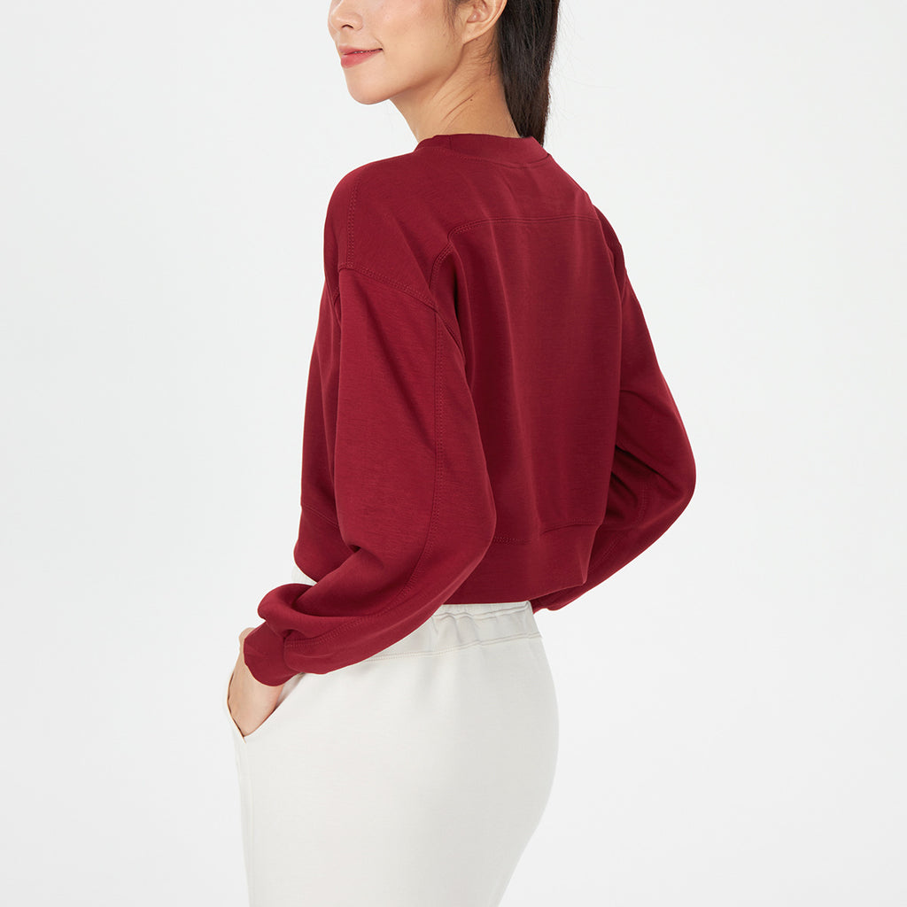 Red cropped crewneck sweatshirt with oversized long sleeves and ribbed cuffs