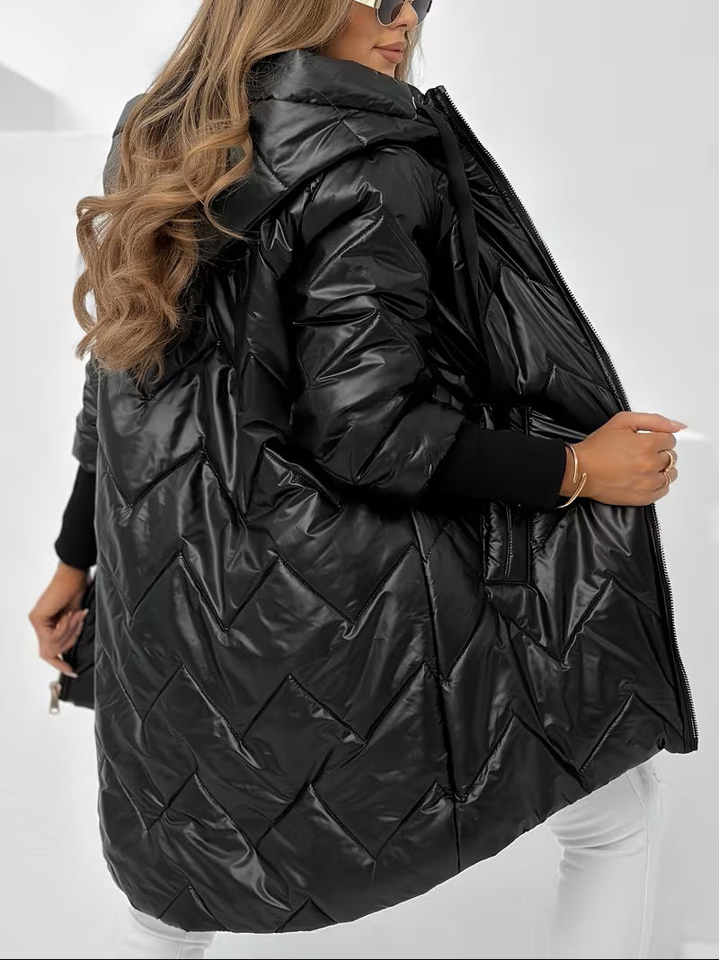 Women's long shiny black puffer coat with hood, quilted back panels, and wide fit