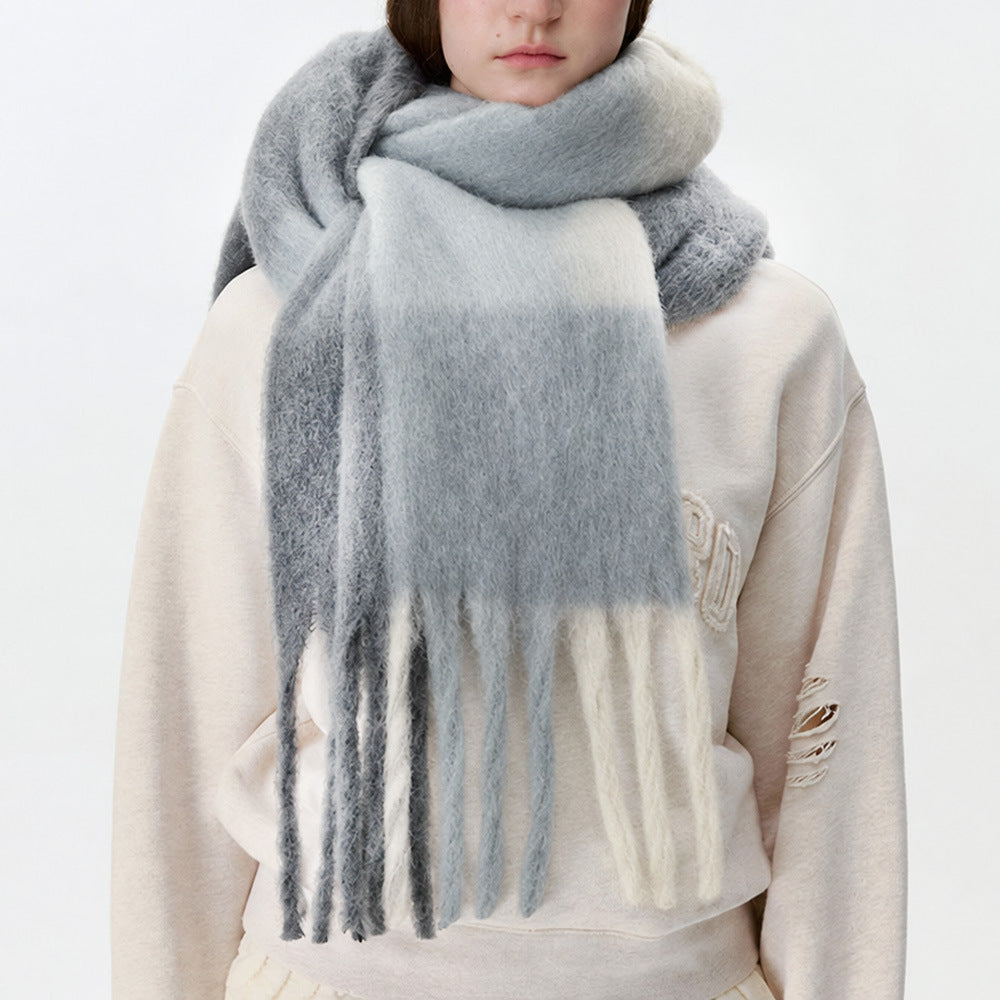 Plaid scarf in light gray and white with long fringed ends, fluffy texture