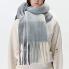 Plaid scarf in light gray and white with long fringed ends, fluffy texture