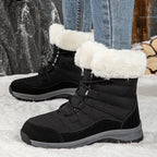 Women’s black lace-up snow boots with faux-fur cuffs and rugged lug sole