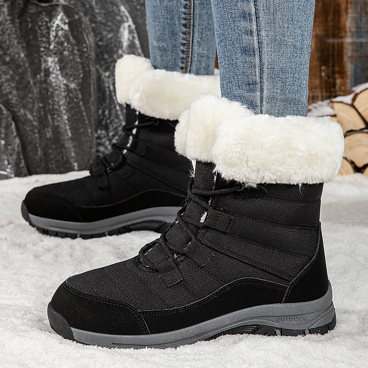 Women’s black lace-up snow boots with faux-fur cuffs and rugged lug sole