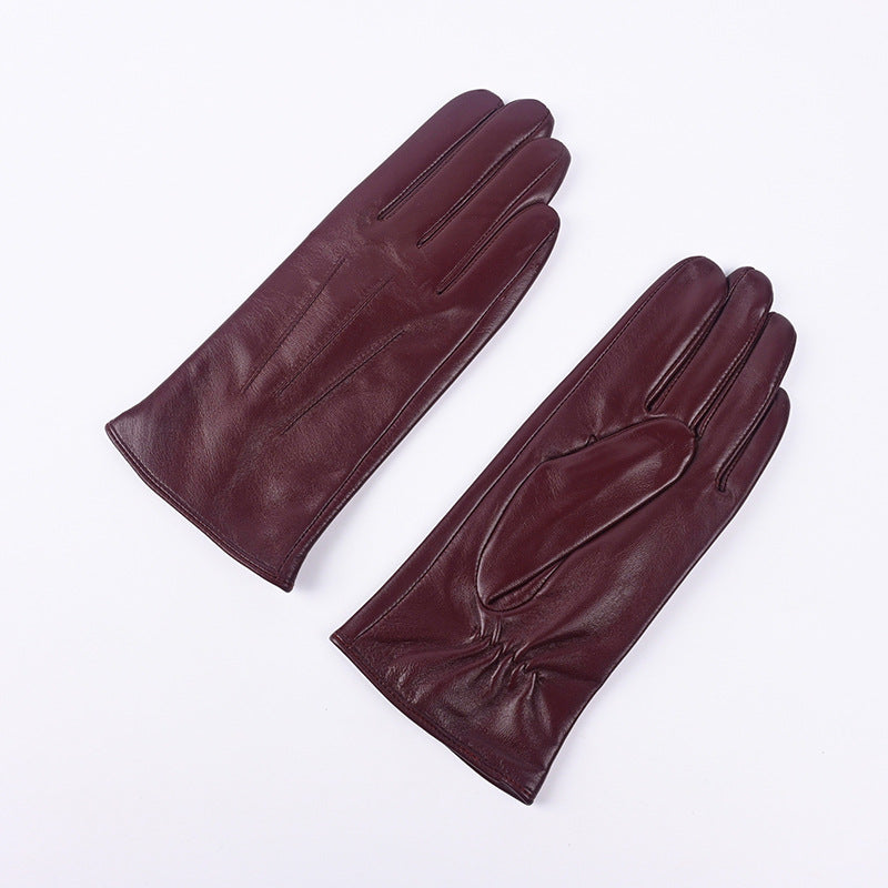 Women's burgundy leather winter gloves pair, fleece-lined, three-panel stitched design